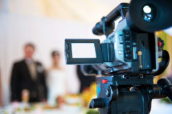 video marketing camera pointed at wedding