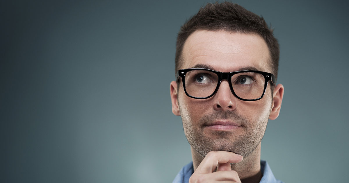 website development agency man with glasses thinking